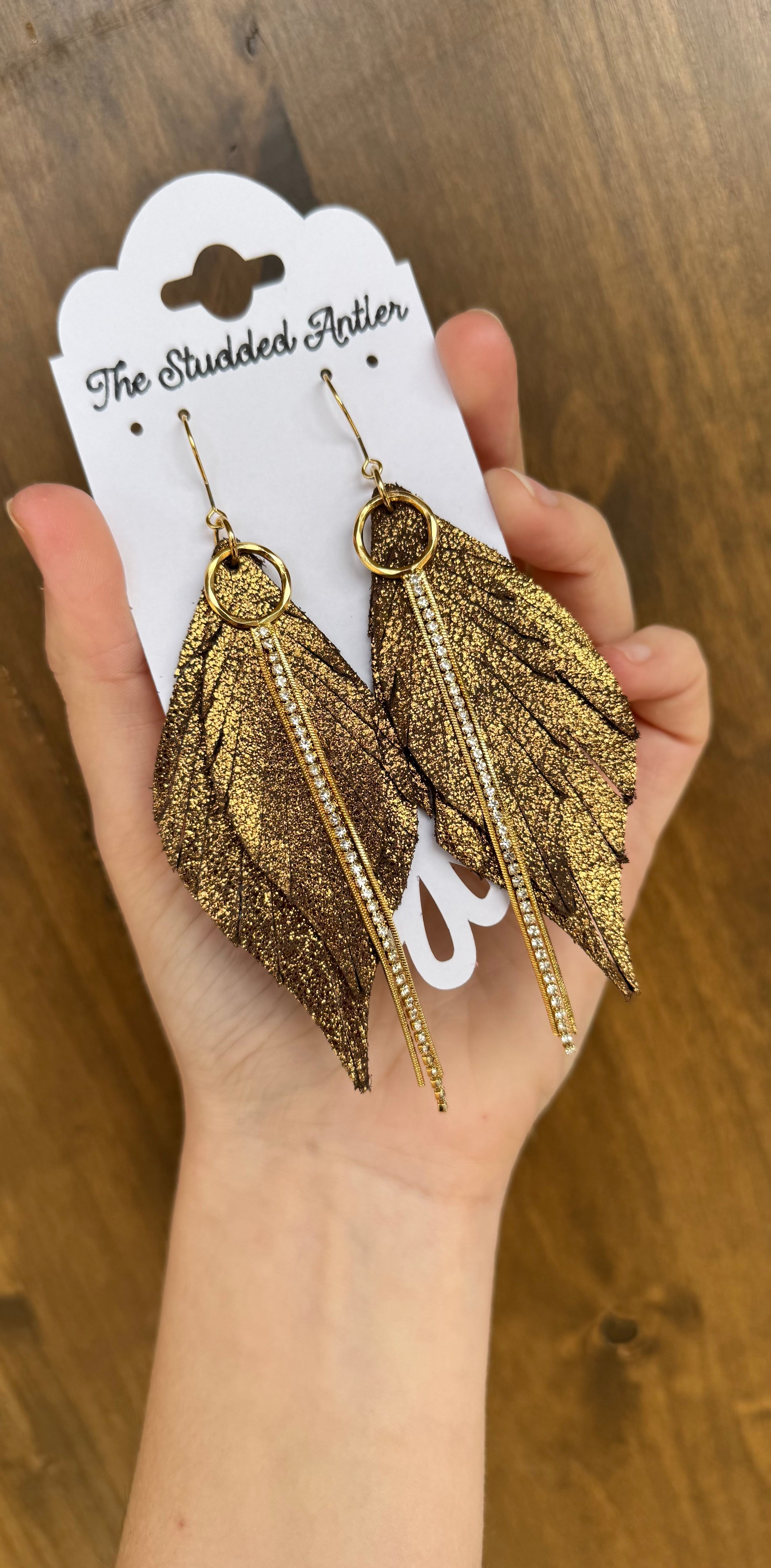 brown shimmer leather earrings with gold rhinestone tassels