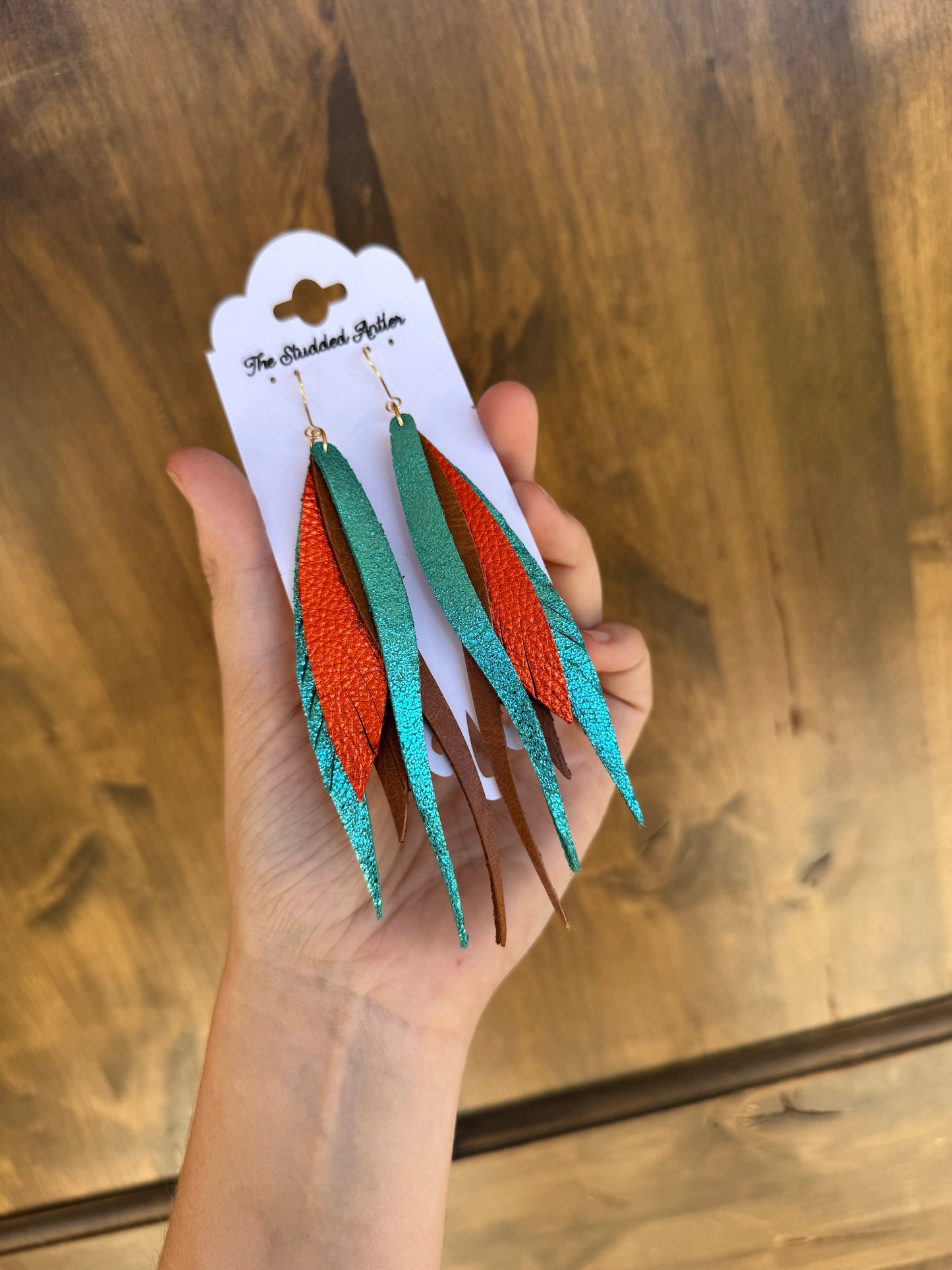 Orange-metallic-leather-fringe-earrings